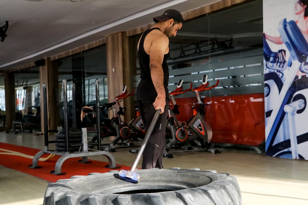 muscle recovery science - a man with a mop in a gym