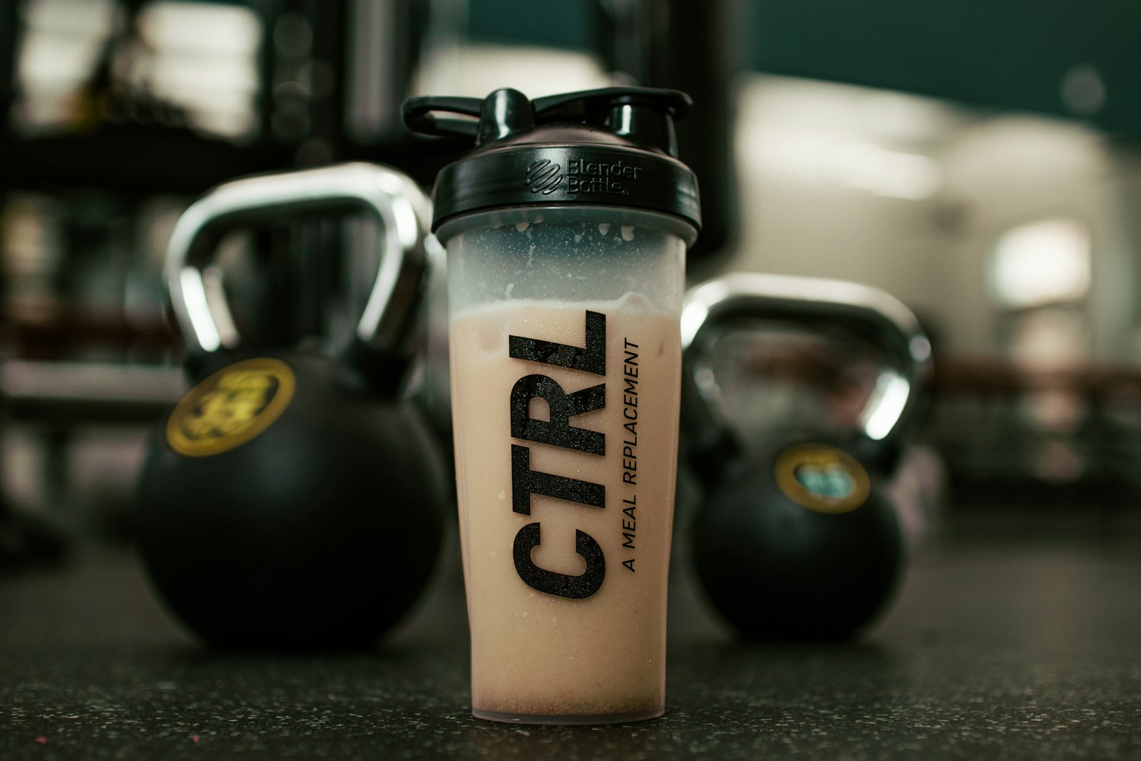 Protein shake and meal-prep bowls on a kitchen counter